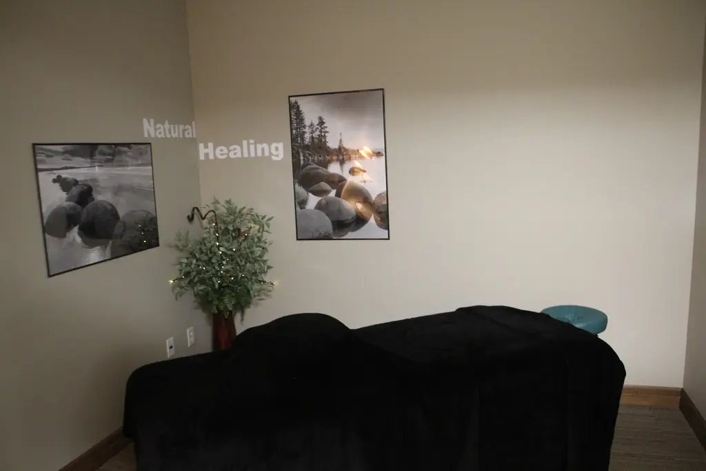 Treatment and massage room at Alpha Chiropractic with Natural Healing wall art
